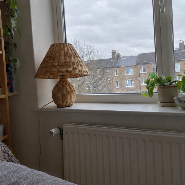 Rattan table lamp on a windowsill